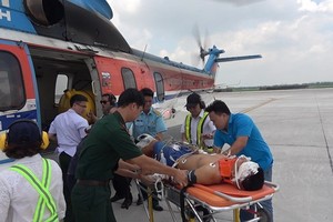 Helicopter flies patient ashore for emergency treatment