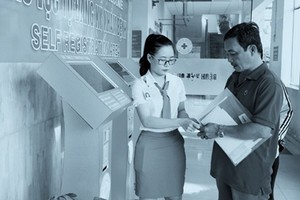 Patients are checking in a hospital using the kiosk system 