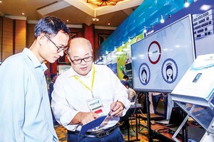 Introducing a piece of security software at a national conference on cyber safety. (Photo: VNA)