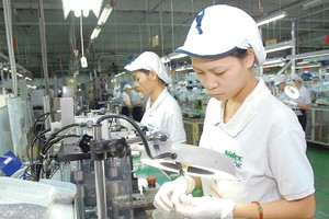 Vietnamese workers at a Japanese -invested company (Photo: SGGP)