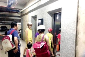 Firefighters rescue men trapped in an elevator during power outage 