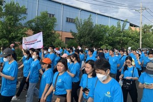 Sponsored walk in HCMC helps workers and union members