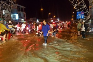 High tide inundated roads of Can Tho city