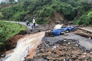 Huge flooding separates traffic roads through Bat Xat District, Lao Cai Province