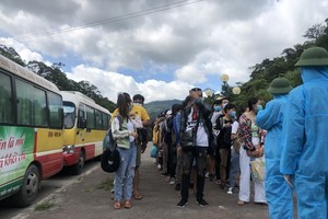 After performing relevant procedures, Laotian students are sent to isolated areas