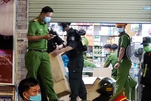  Functional forces check a drugstore in Bien Hoa city 