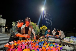 Ceremony of lighting lanterns in memory of 504 victims in Son My massacre