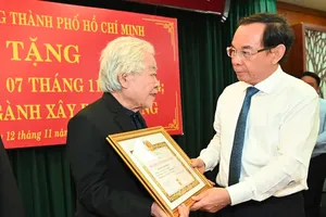 City Party Chief awards Party membership badges to veteran Party members