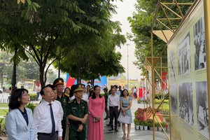 Photo exhibition featuring Party's 95-year history opens in downtown HCMC