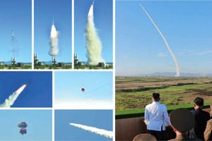 金正恩（右圖，左一）視察試射新型防空導彈。（圖源：互聯網）