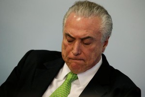 如果被判存在違法行為，特梅爾將被罷免總統一職。（圖源：AFP）