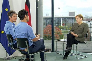 德國總理默克爾回答德媒的專訪。（圖源：DW）