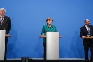 當地時間3月4日，德國社民黨全體黨員投票通過與默克爾領導的聯盟黨聯合組閣的方案，兩黨將按此前協議組建新政府。（圖源：新華網）