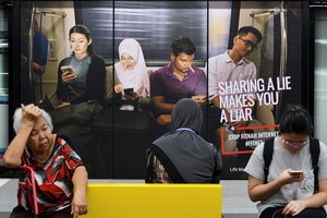 馬來西亞國會下議院日前三讀通過反假新聞法案，散播假新聞可囚 6 年。（示意圖源：路透社）