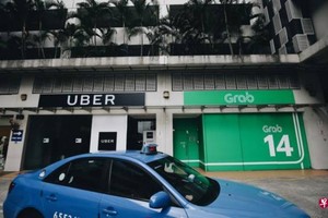 新加坡競爭與消費者委員會正式向私召車業者Grab和優步(Uber)發出一套臨時措施指示，以讓當局在調查兩家業者收購交易期間能確保市場環境的公平競爭。（示意圖源：互聯網）