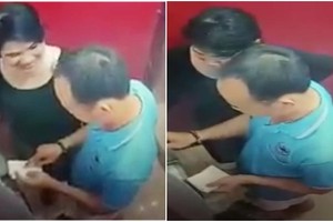 櫃員機監控系統錄下盜取款項的夫婦畫面。（圖源：監控視頻截圖）