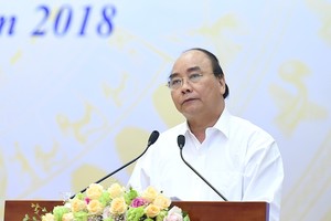 政府總理阮春福主持會議。（圖源：光孝）