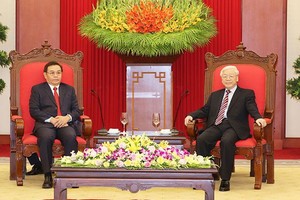 阮富仲總書記接見賽宋蓬主席。（圖源：VOV）