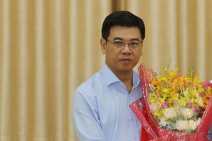 新任第一郡人委會主席阮文勇同志。