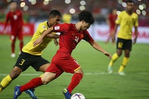 越南隊(紅衣)-馬來西亞隊比賽一瞥。（圖源：互聯網）