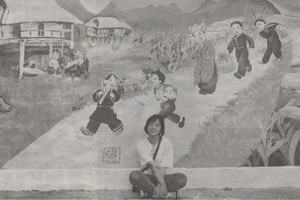 畫家與志願者在某所學校創作的一幅畫。