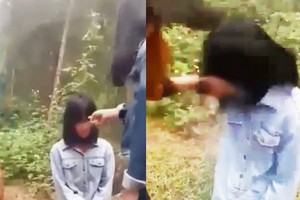 初中七年級一女生被一夥學生強迫跪下及搧耳光。