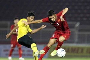 越南隊（紅衣）－馬來西亞隊比賽一瞥。（圖源：互聯網）