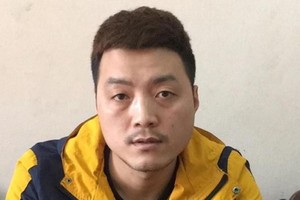 投案自首的通緝犯梁文秀。（圖源：警方提供）