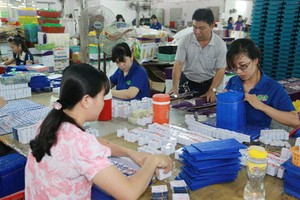 遲緩給勞工支付薪資，企業的最高罰款 達１億元。（圖源：N. Tú）