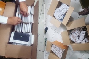 被扣留的走私 iPhone 手機。（圖源：Đ.X）