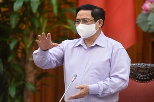 政府總理范明政主持會議並發表講話。（圖源：VGP）