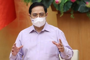 政府總理范明政主持會議並發表講話。（圖源：越通社）