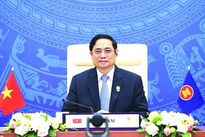 政府總理范明政在會議上致詞。（圖源: 越通社）