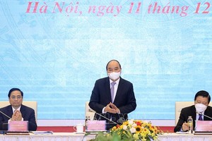 國家主席阮春福、政府總理范明政主持研討會。（圖：VOV）