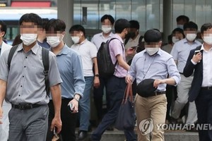 職場一族。（圖：韓聯社）