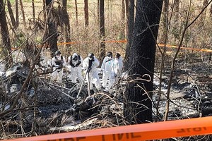 直升機墜毀的現場。（圖：韓聯社）