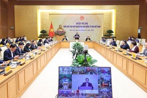 政府總理范明政主持推動吸引來越國際遊客會議。（圖：VGP）