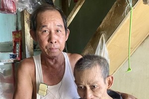 梁平池（左）和梁全。