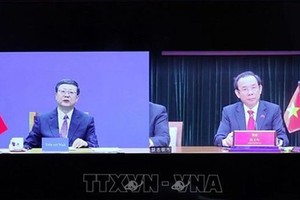 胡志明市市委书记阮文年已与中国共产党中央政治局委员、上海市委书记陈吉宁举行视频会议。（图：越通社）