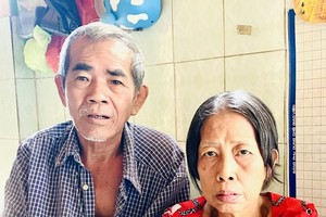 梁耀心与妻子符达贞。