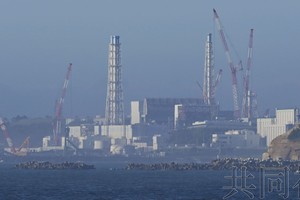 图为摄于8月24日早晨6点25分的东京电力公司福岛第一核电站。（图：共同社）