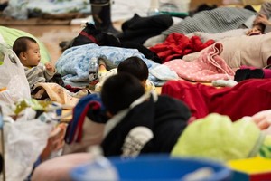  这是1月3日在日本石川县轮岛市一处容纳超700人的临时避难所内拍摄的儿童。（图：新华社）