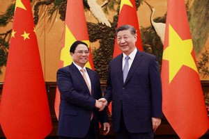 政府总理范明政会见中国总书记、国家主席习近平。（图：越通社）