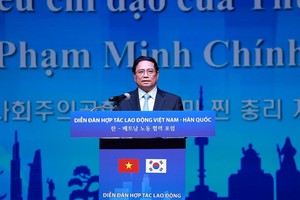 越南政府总理范明政在越南-韩国劳务合作论坛上发言。（图：越通社）