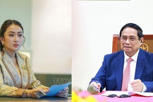 政府总理范明政与泰国总理‧钦那瓦通电话会谈。（示意图：越通社）