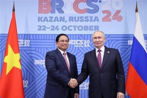 越南政府总理范明政与俄罗斯总统普京举行会谈。（图：越通社）