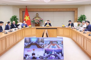 政府副总理陈红河（中）主持会议。（图：VGP）