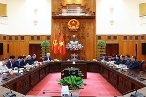 政府总理范明政主持会议。（图：VGP）