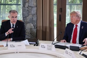 加拿大总理卡尼与美国总统特朗普。（图：Getty Images）