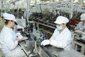 Manufacturing electronic components at the Japan-based Nidec Sankyo Ltd Co in the Saigon Hi-tech Park in HCM City. (Photo: VNA/VNS)